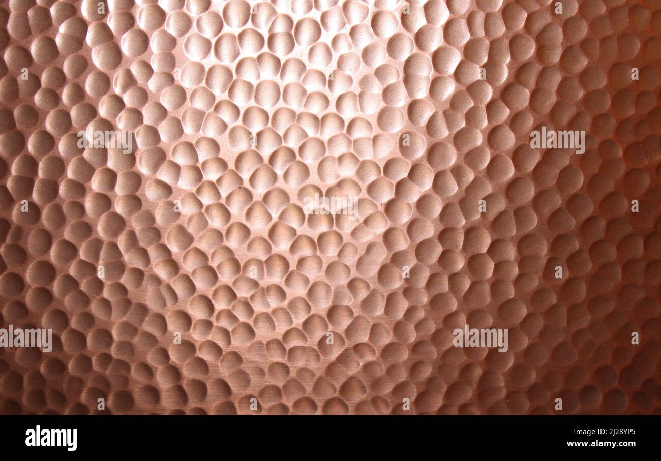 A Closeup Hammered Copper Texture Stock Photo