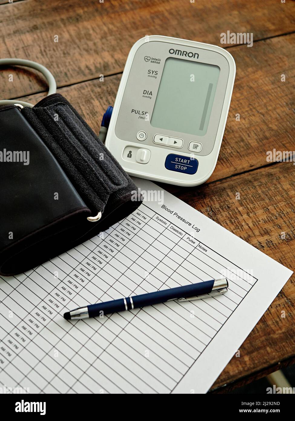 Sphygmomanometer or blood pressure monitor, cuff, and chart ready to monitor heart health.  Concept of healthy lifestyle. Stock Photo