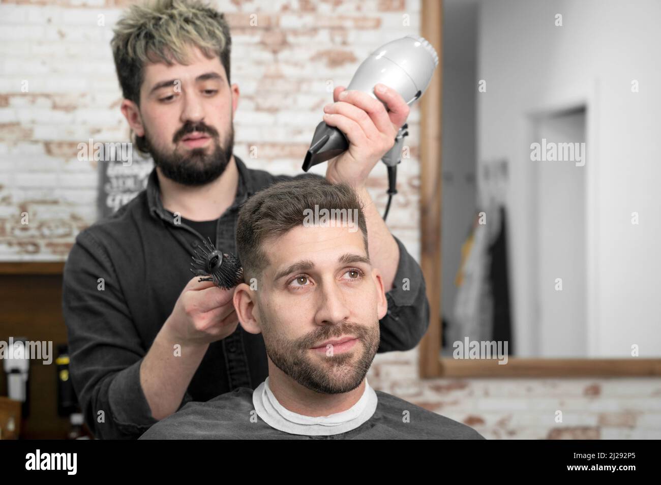 Barber working hair dryer hi-res stock photography and images - Alamy