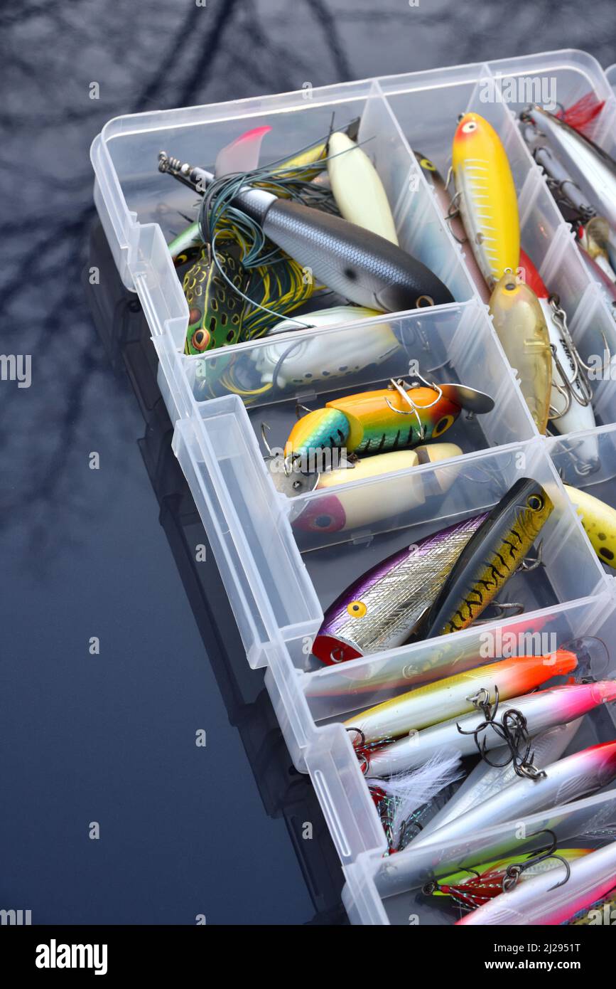 Fishing tackle lures and tackle box Stock Photo