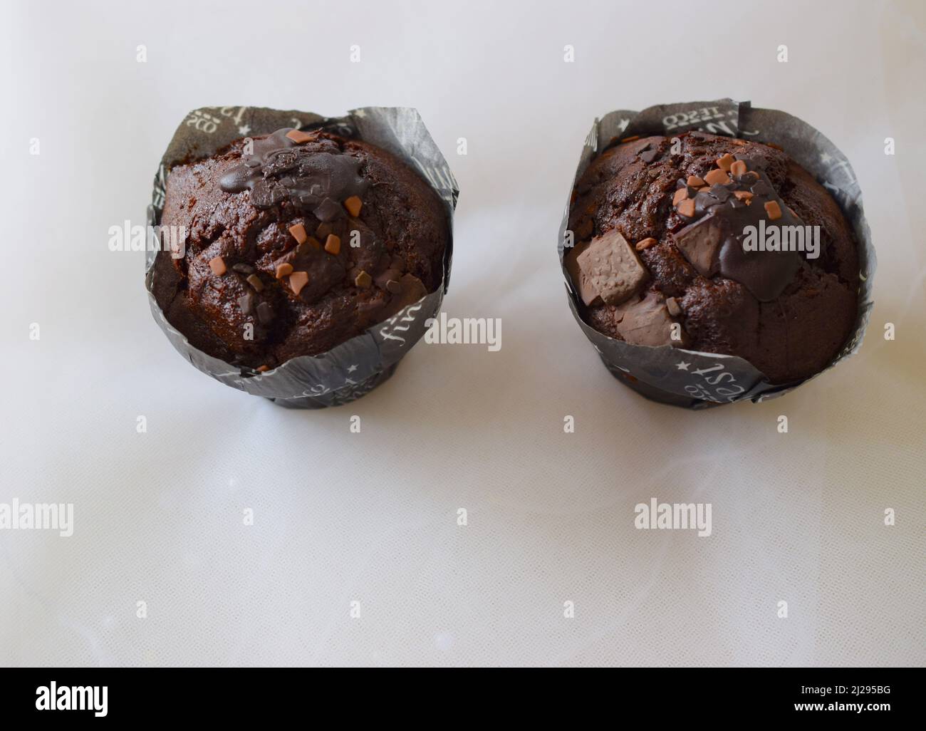 Chocolate cupcakes on light background. Stock Photo
