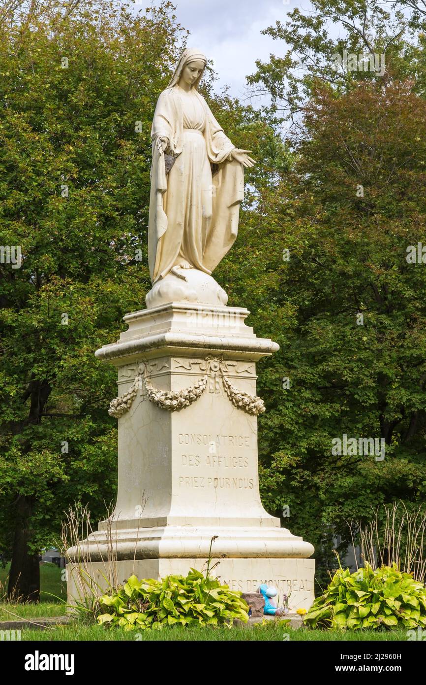 Virgin Mary statue in Notre Dame des Neiges cemetery on MountRoyal