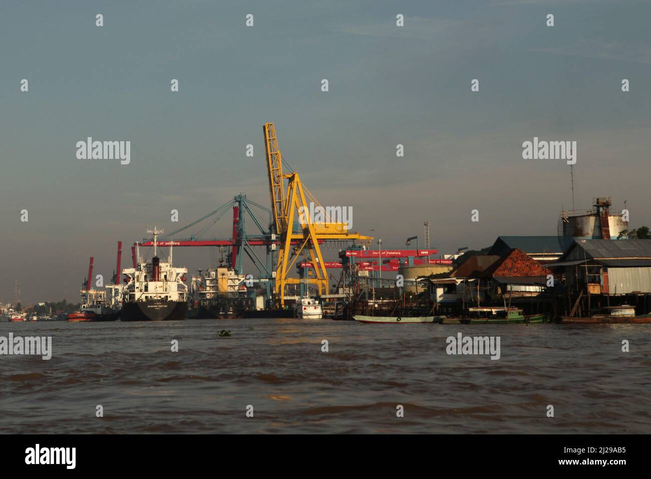 Port of Palembang on the bank of Musi river in Palembang, South Sumatra, Indonesia. Stock Photo
