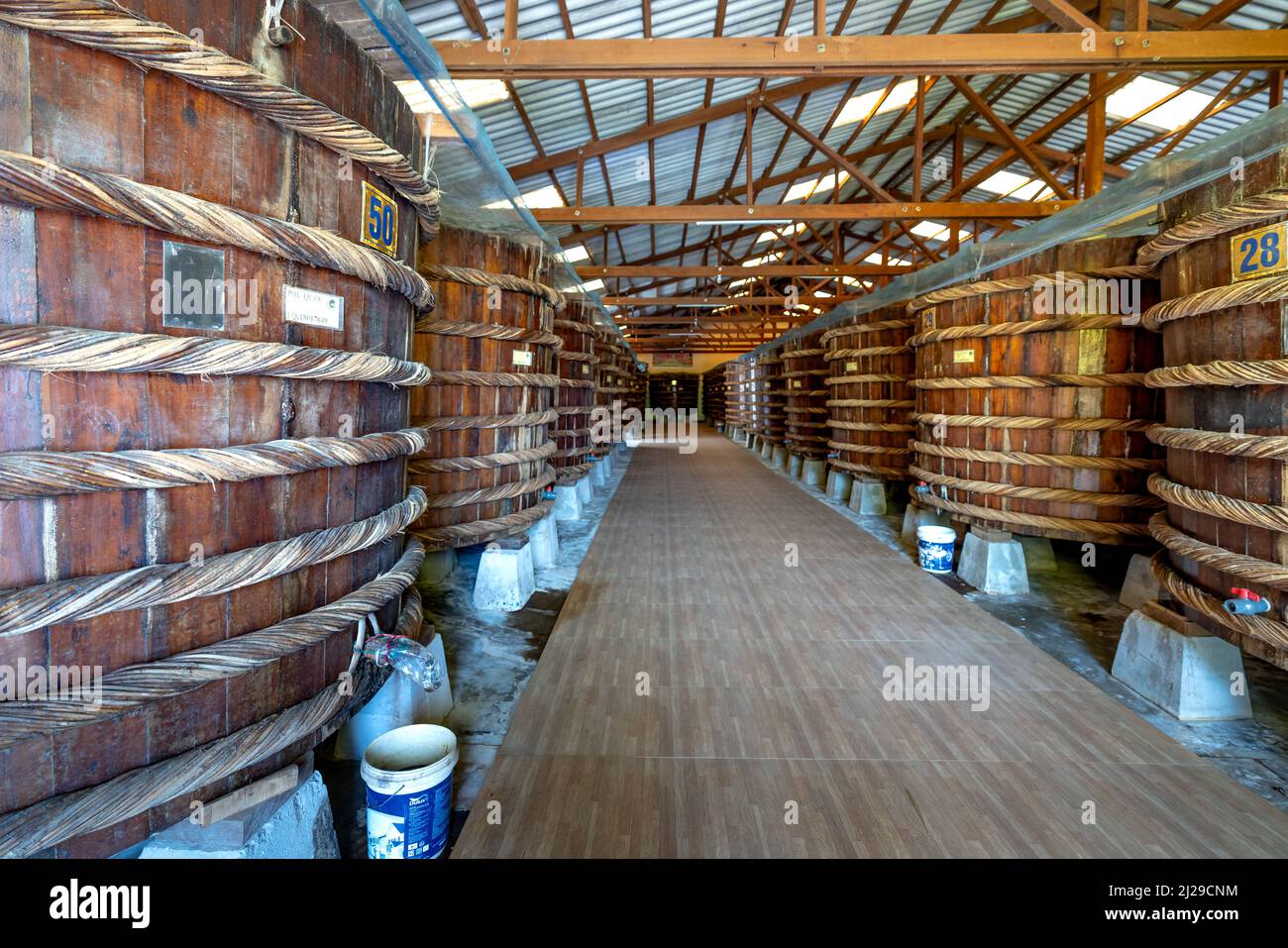 Phu Quoc Island, Vietnam - February 24, 2022: At the fish sauce production facility, the factory on Phu Quoc island follows the traditional fermentati Stock Photo