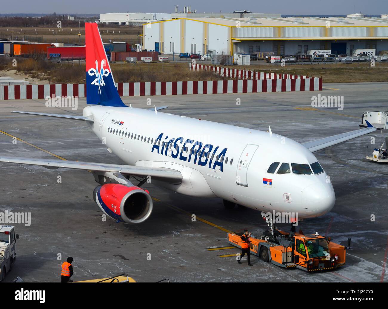 Air Serbia Airbus A319 airplane being towed for the flight to Nikola Tesla Belgrade Airport in