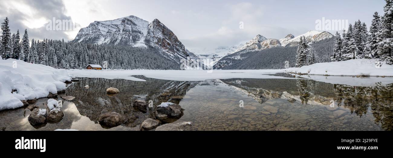 Winter time in Lake Louise with stunning snow capped mountains in ...