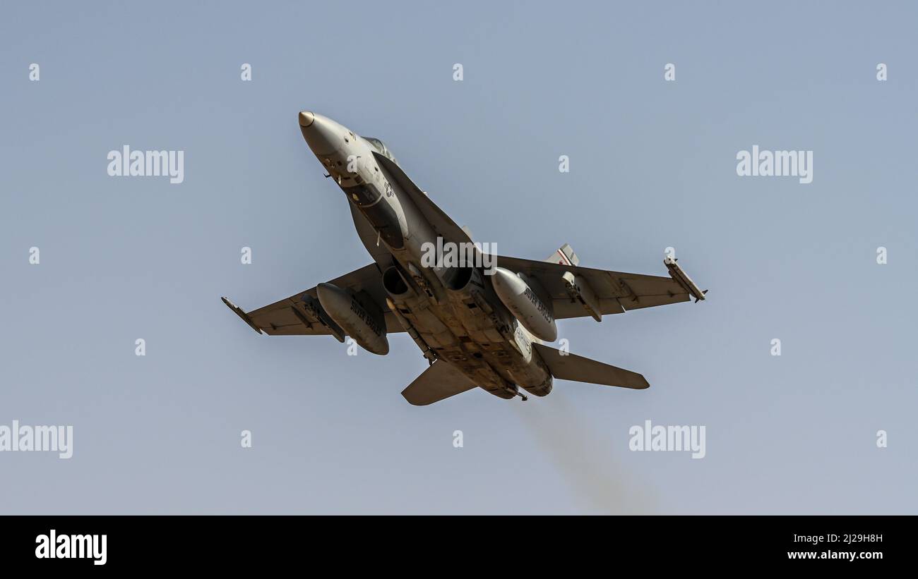 A U.S. Marine F/A-18 Hornet assigned to the Marine Fighter Attack Squadron 115 takes off from Prince Sultan Air Base, Kingdom of Saudi Arabia, Jan. 25, 2022. The F/A-18 is a twin-engine, supersonic, all-weather, carrier-capable, multirole combat jet, designed as both a fighter and attack aircraft. (U.S. Air Force photo by Staff Sgt. Christina A. Graves) Stock Photo