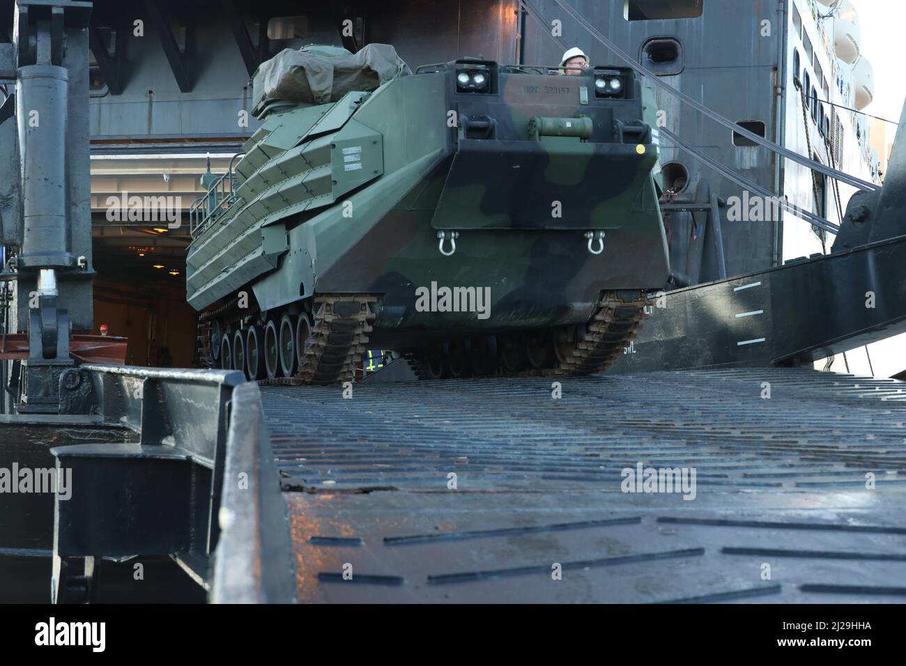 An AAV7A1 tracked vehicle is offloaded from the USNS 1st Lt. Jack