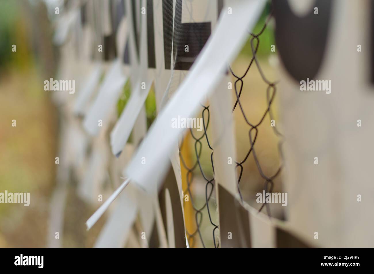 The banner is attached to the Rabitz grid. White banner with perforated