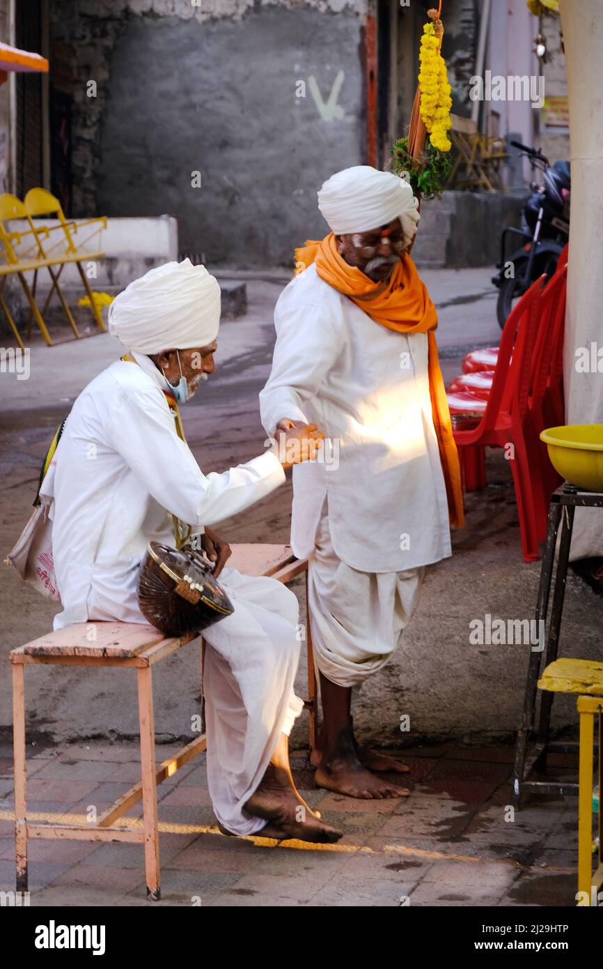 PANDHARPUR, MAHARASHTRA, INDIA, 27 February 2022, Procession of Varkari-Hindu Pilgrims, Devotee called VARKARI with flag going to Pandharpur VARI, The Stock Photo