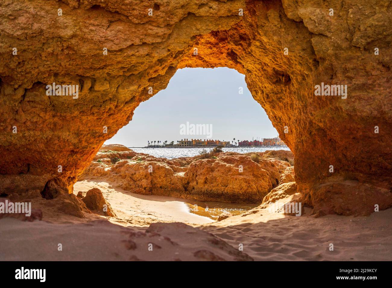Beautiful sandstone arch with the view on marina in Portimao, Ferragudo, Algarve, Portugal Stock Photo