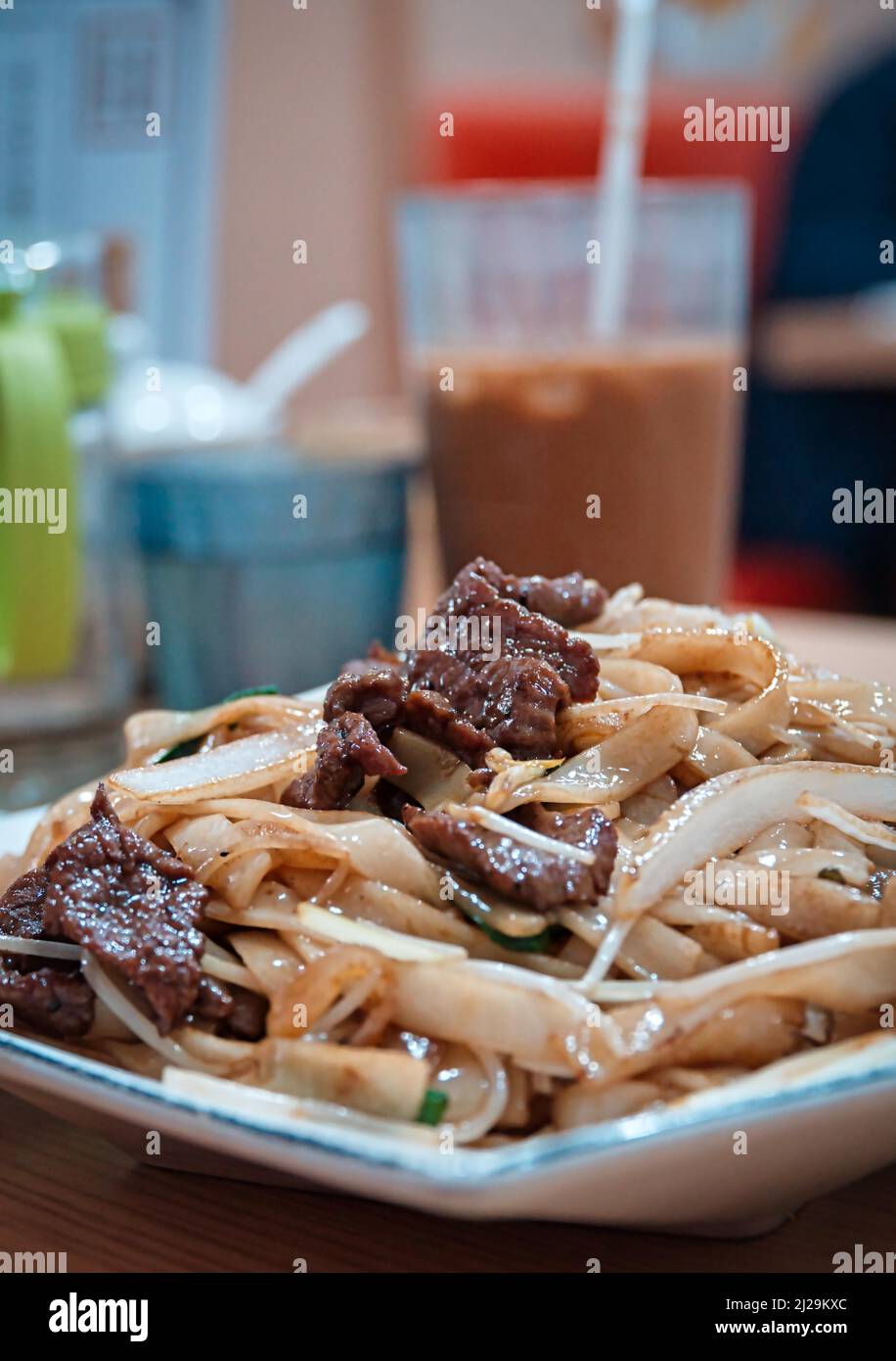 Stirfried rice noodles with beef in a Cantonese restaurant in Macau