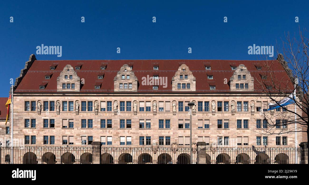 Main facade of the justice building with thirteen stone sculptures from law, Nuremberg, Middle Franconia, Bavaria, Germany Stock Photo