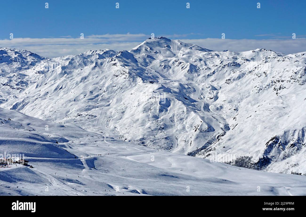 View of snow-capped mountains and landscape with ski slopes and La Masse summit, Trois 3 Vallee ski resort, Les Menuires, Haute Savoie, High Savoie Stock Photo