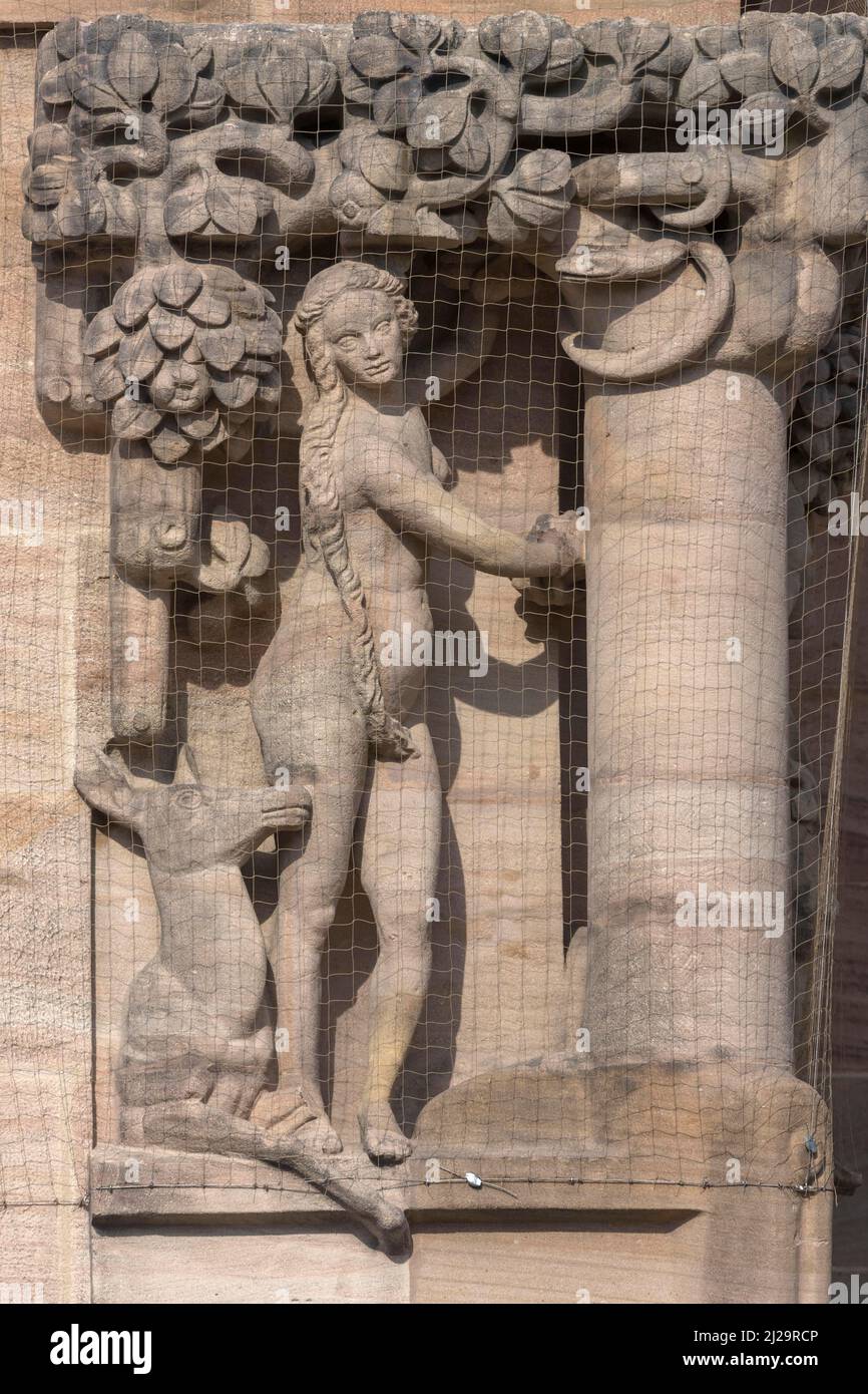 Stone sculpture Eva in the Garden of Eden, on the facade of the Justice Building, Nuremberg, Middle Franconia, Bavaria, Germany Stock Photo