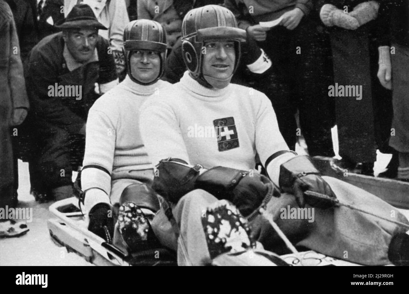 Bobsleigh sport, the two-man bob Switzerland II with Fritz Feierabend and Joseph Beerli shortly in front of the start, silver medallist, silver Stock Photo