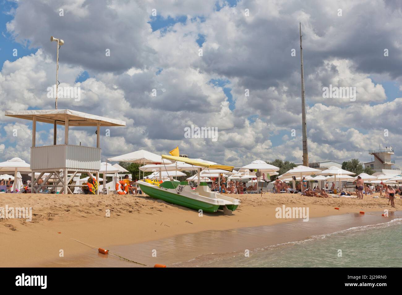 Zaozernoe, Saksky district, Evpatoria, Crimea, Russia - July 23, 2021: Catamaran rental on the beach of the Evolution sports center in the village of Stock Photo