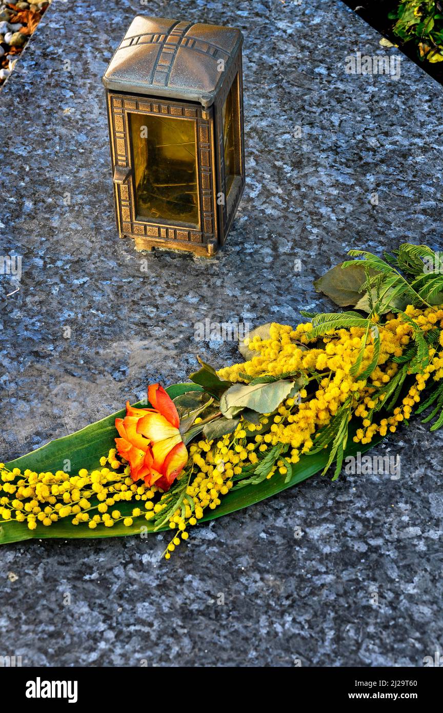 Grave slab with grave light and flower decoration, Betzigau, Allgaeu, Bavaria, Germany Stock Photo