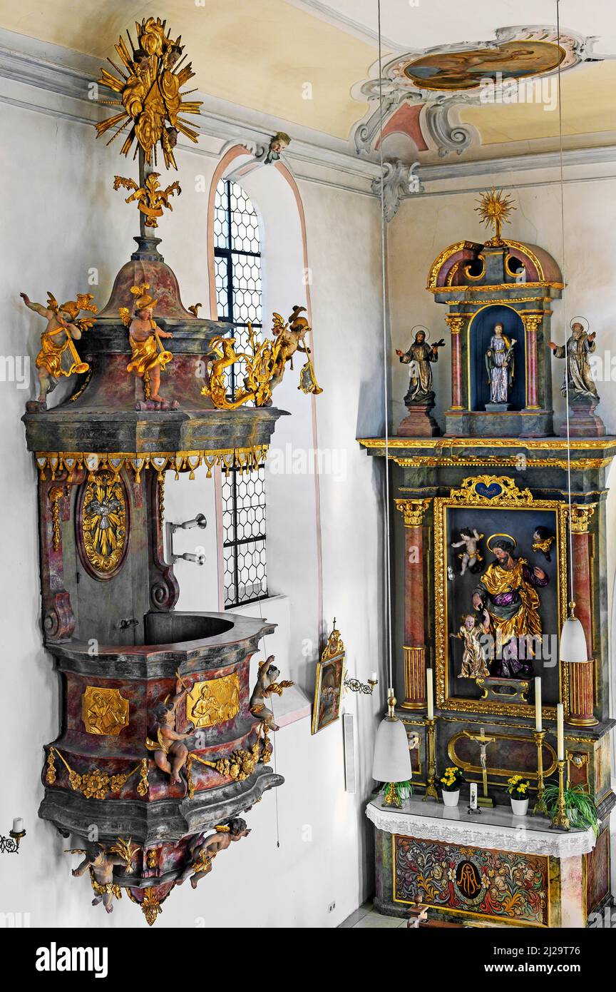 Pulpit and side altar, St. Afra Catholic Parish Church, Betzigau, Allgaeu, Bavaria, Germany Stock Photo