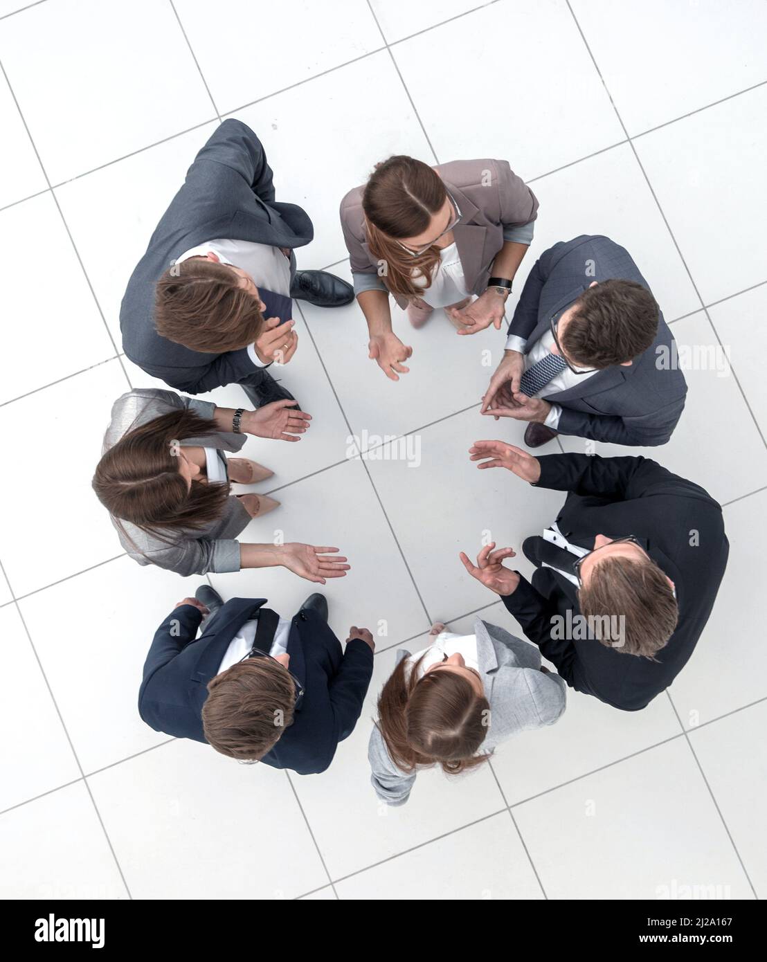top view.business team discussing something standing in a circle Stock ...