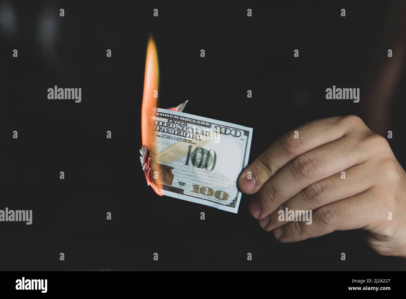 Hands and burnning money - business concept. concept of inflation. abandoning the dollar Stock Photo