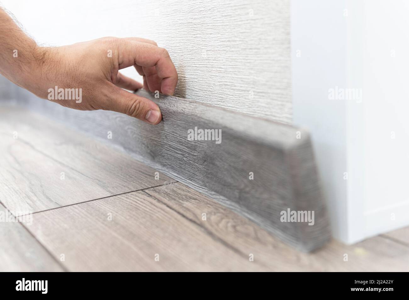 installing the floor skirting board. dismantling of the plastic