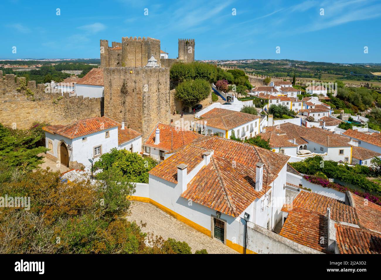 Rooftops of town and medieval fortress. Obidos. Portugal Stock Photo