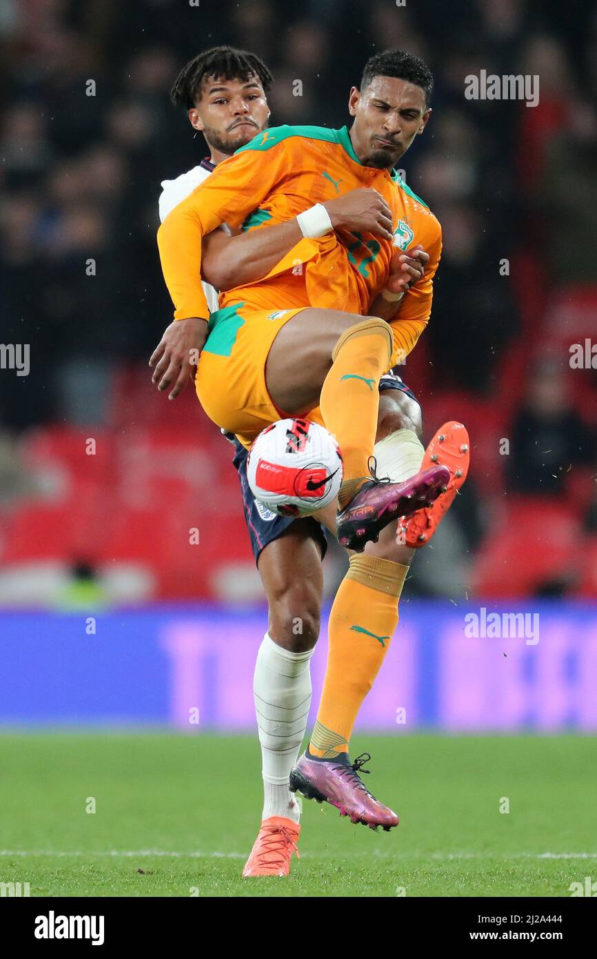 TYRONE MINGS, SEBASTIEN HALLER, ENGLAND V IVORY COAST, 2022 Stock Photo