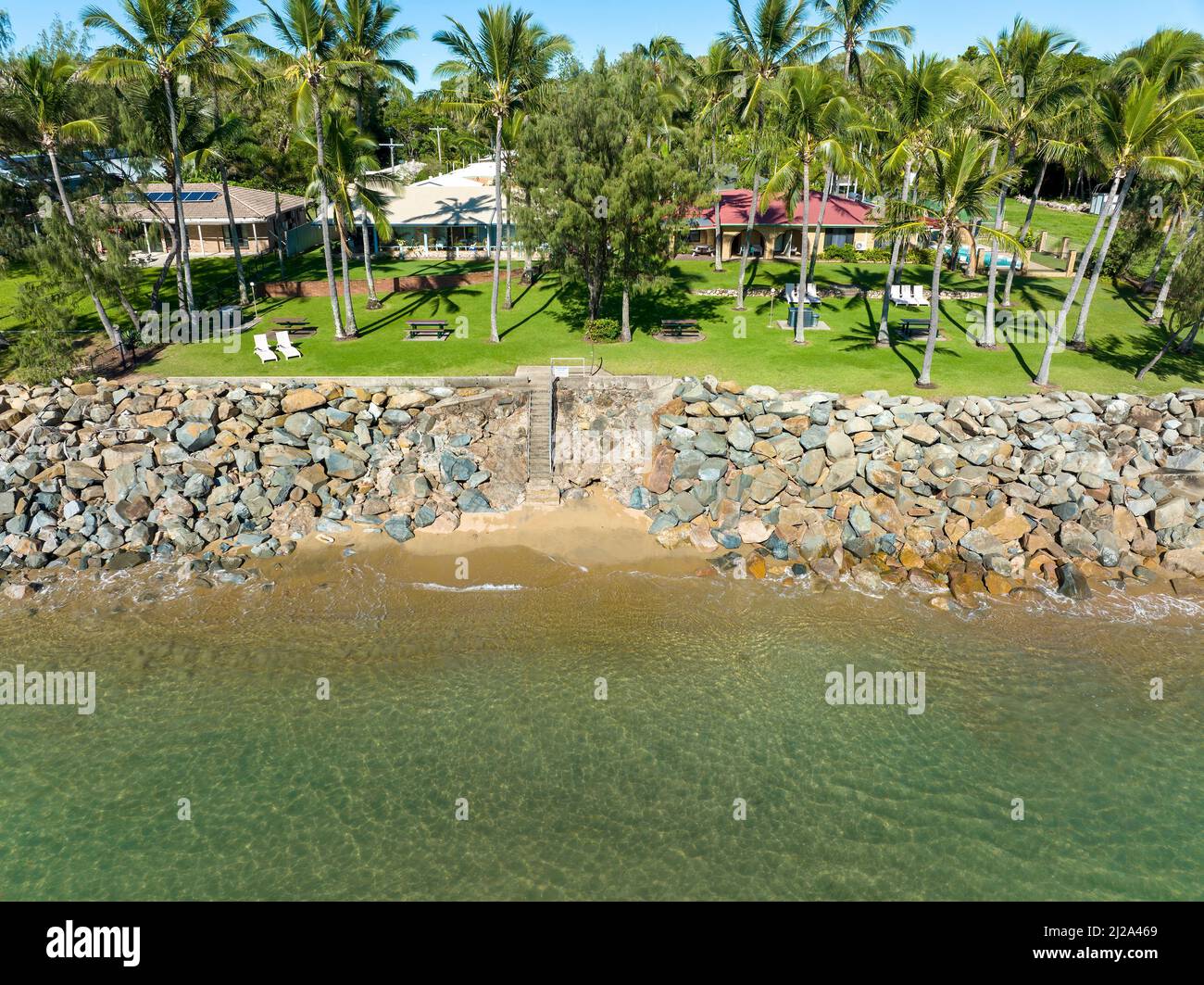 Blacks Beach, Mackay, Queensland, Australia - April 2022: Drone aerial of the absolute beachfront location of the tropical Comfort Resort Blue Pacific Stock Photo