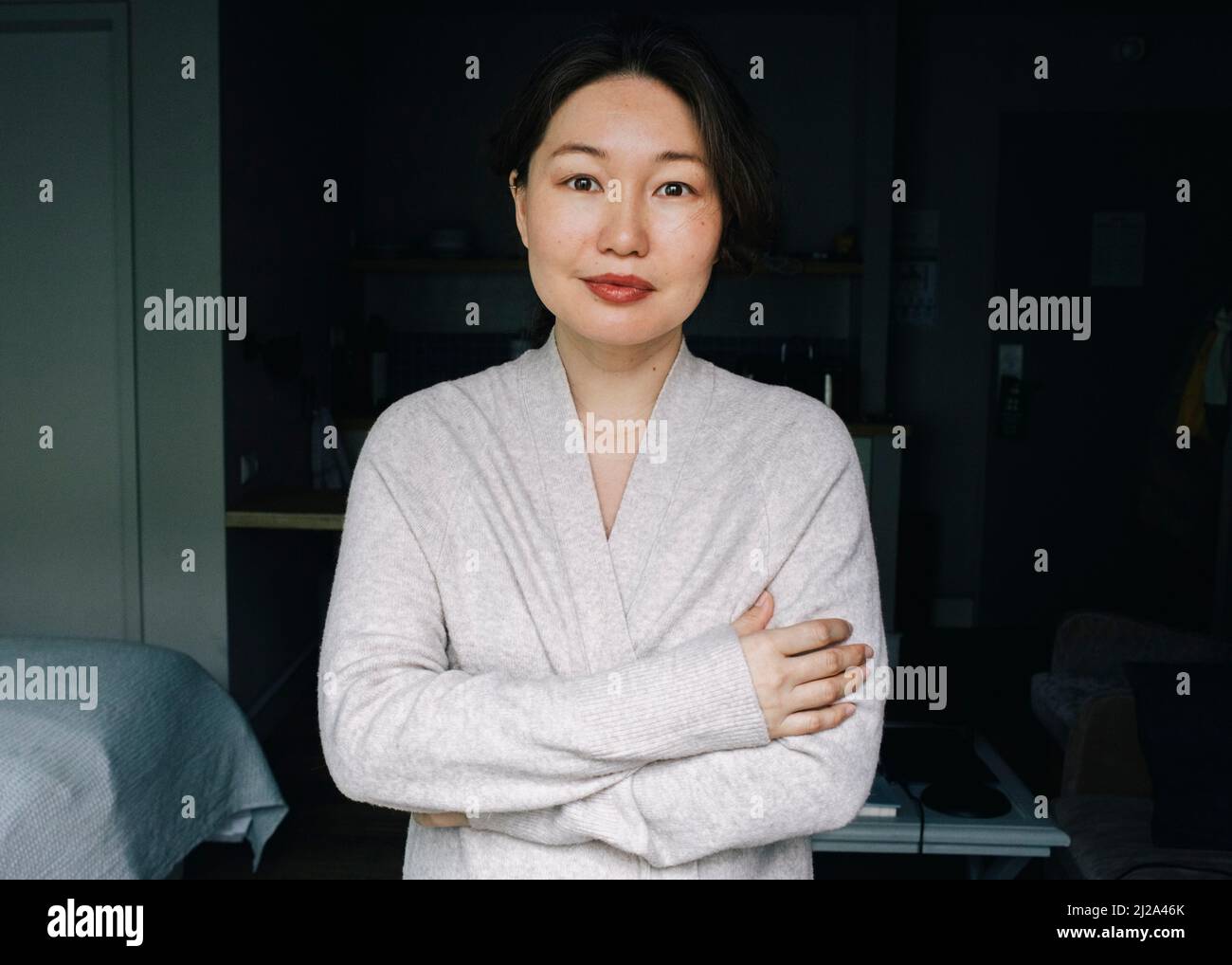 Arms crossed standing woman hi-res stock photography and images - Alamy