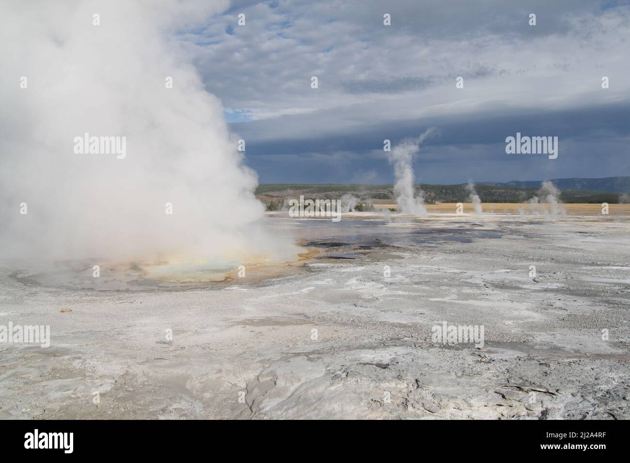 Yellowstone Spring Steam The steam emitting from the hot spring at Yellowstone National Park in ...