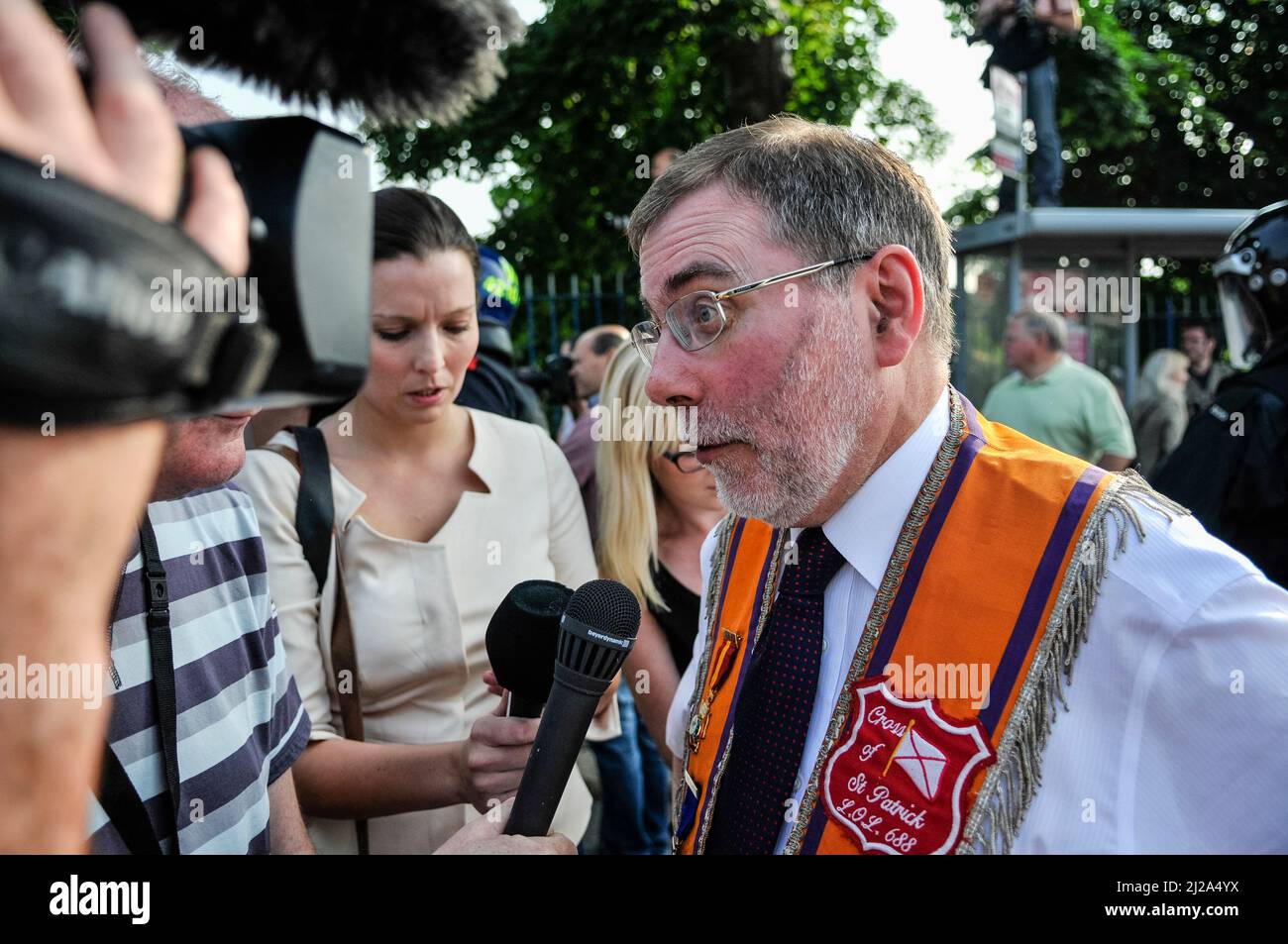 Belfast, Northern Ireland, 12th July 2013 - Nelson McCausland MLA gives a press statement after an Orange Order feeder parade was stopped by PSNI when it was clear that more than the permitted 100 supporters were attempting to march past Ardoyne shops. Stock Photo