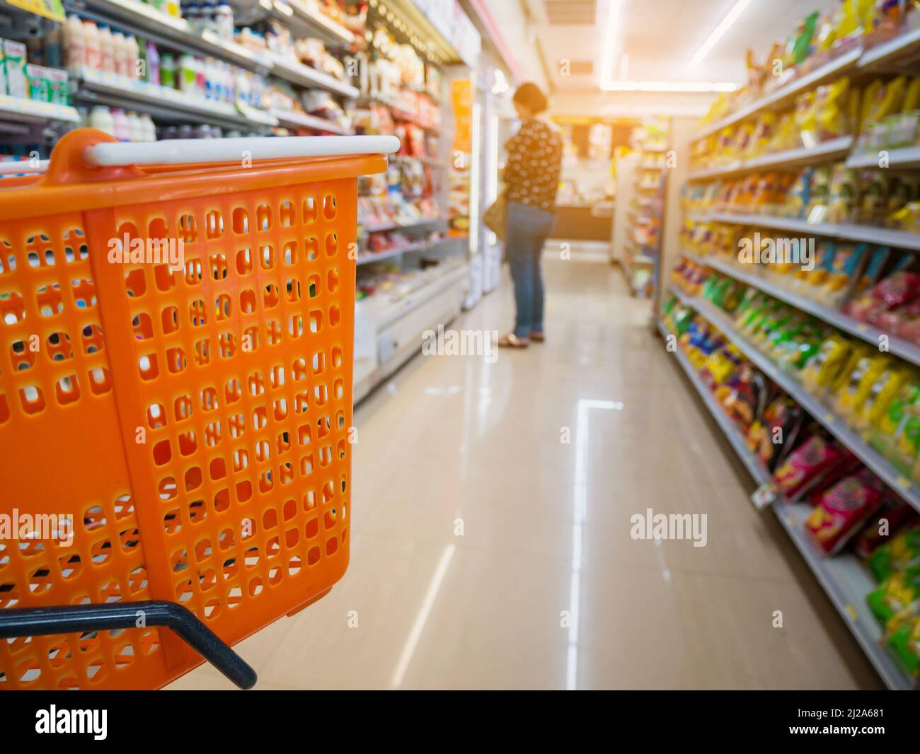 empty basket on shopping cart in supermarket or convenience store Stock