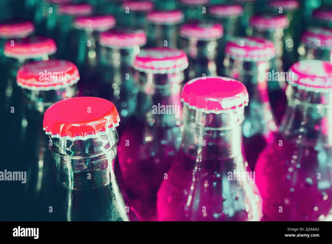 glass bottles with soft drinks background Stock Photo Alamy