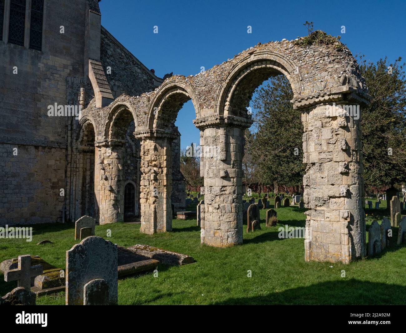 The remains of the Norman choir arcade of St Bartholomews church Ordford Stock Photo