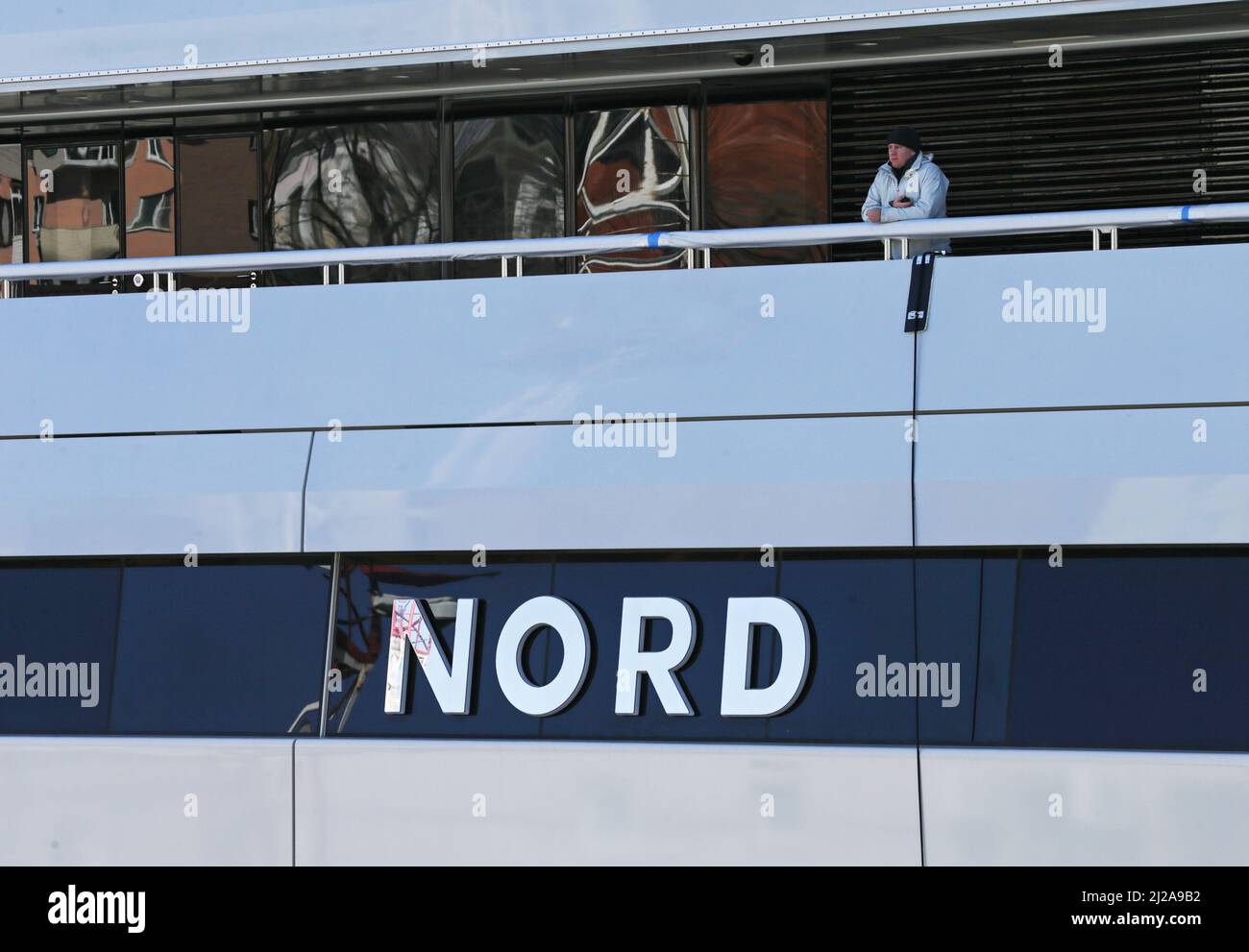 A man is seen aboard the superyacht Nord, reportedly owned by the sanctioned Russian oligarch Alexei Mordashov, which is docked in the far eastern port of Vladivostok, Russia March 31, 2022. REUTERS/REUTERS PHOTOGRAPHER Stock Photo