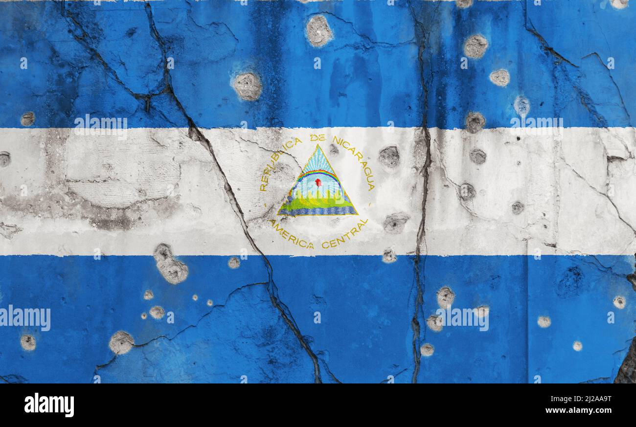 Full frame photo of a weathered flag of Nicaragua painted on a cracked ...