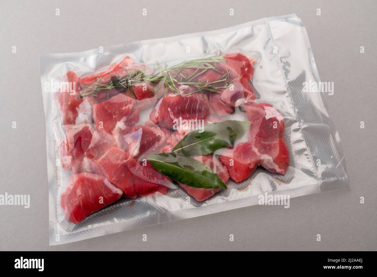 Raw beef stew, pieces of raw meat, in vacuum packed sealed for sous