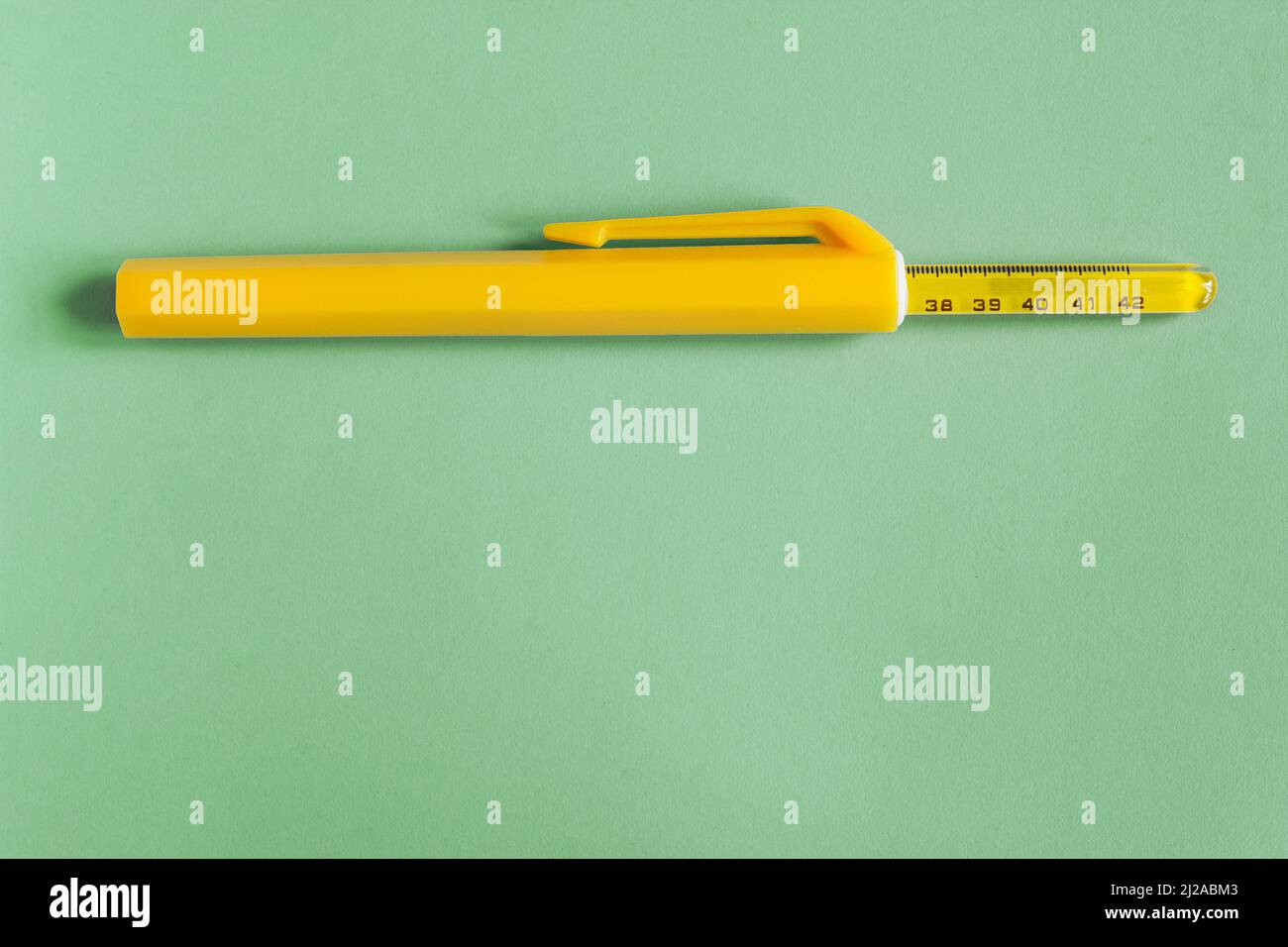 The top of an old mercury thermometer sticks out of its protective storage  case on a colorful textured background with copy space. Objects and medical  Stock Photo - Alamy