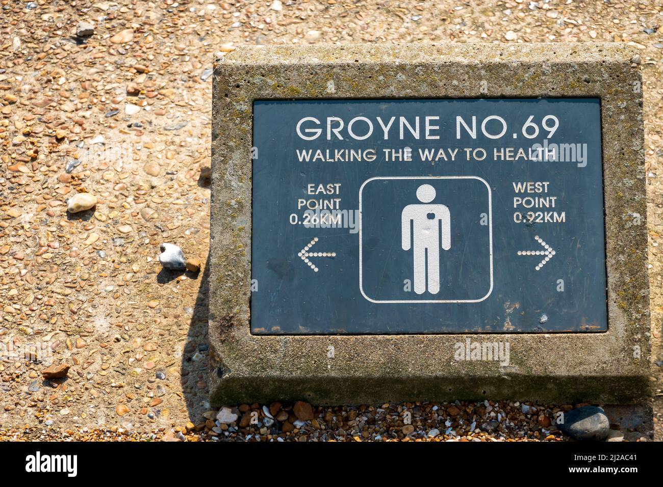 Groyne markers for walkers on the promenade at Bexhill on Sea. Amusing Groyne No 69 title, East Sussex, UK Stock Photo