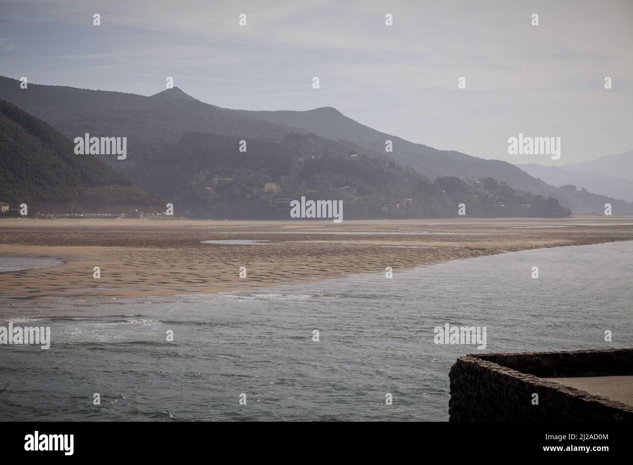 Views of a beautiful landscape in horizontal format of the Urdaibai biosphere reserve, a perfect combination of mountain and beach on a sunny day. Stock Photo