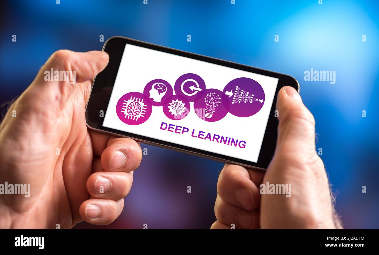Hand holding a smartphone with deep learning concept Stock Photo - Alamy