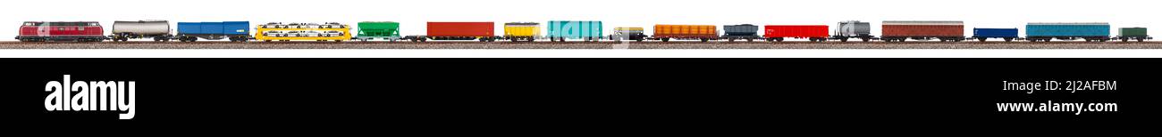 long model railway freight train with colorful wagon isolated on white wide panorama background.  railroad hobby transportation logistic concept Stock Photo