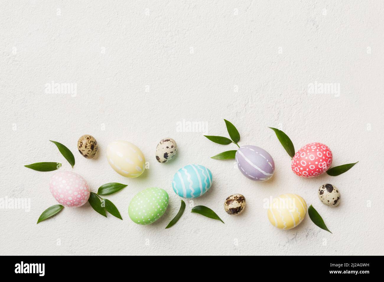 Colorful Easter eggs with spring flower leaf isolated over white ...
