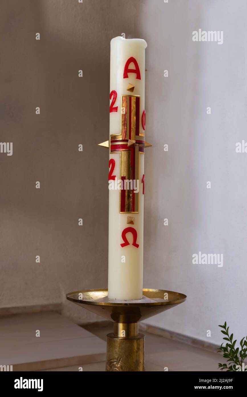 Paschal candle. A new Paschal candle is blessed and lit every year at Easter. Stock Photo