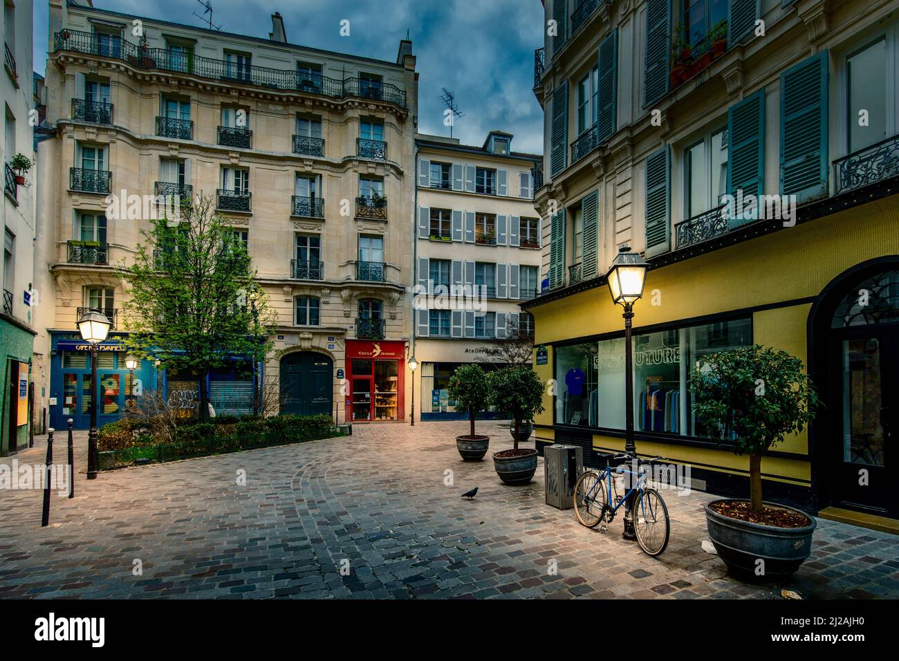Paris, France - March 26, 2021: Typical street in Marais district with Rue des Rosiers in Paris Stock Photo