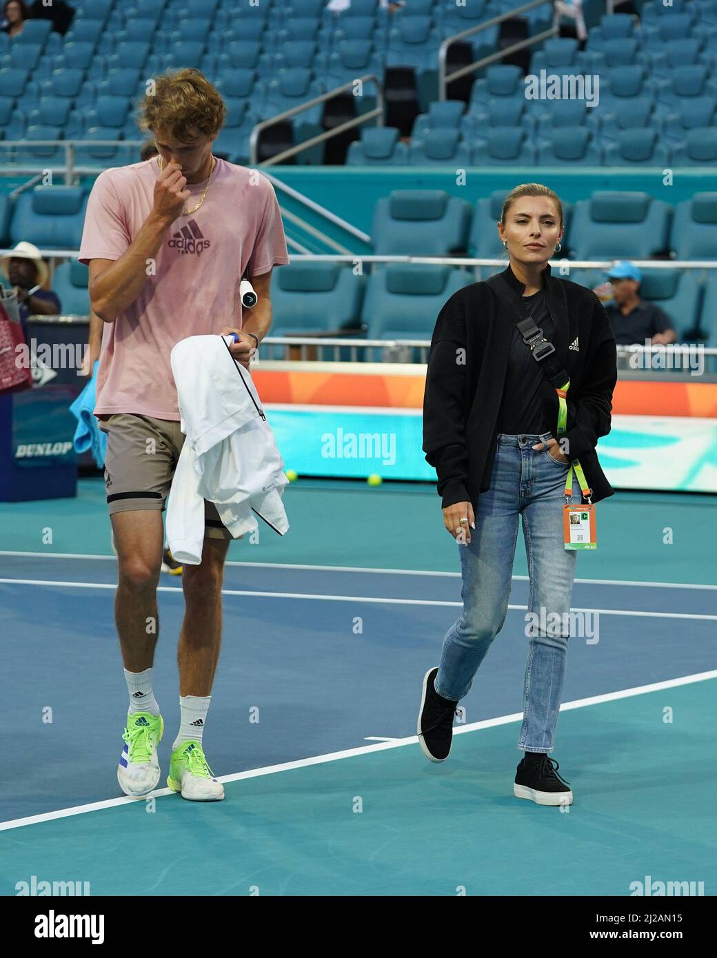 Miami Gardens, FL, USA. 30th Mar, 2022. Alexander Zverev and girlfriend Sophia Thomalla seen walking off the practice court during The Miami Open at Hard Rock Stadium on March 30, 2022 in Miami Gardens, Florida. Credit: Mpi04/Media Punch/Alamy Live News Stock Photo