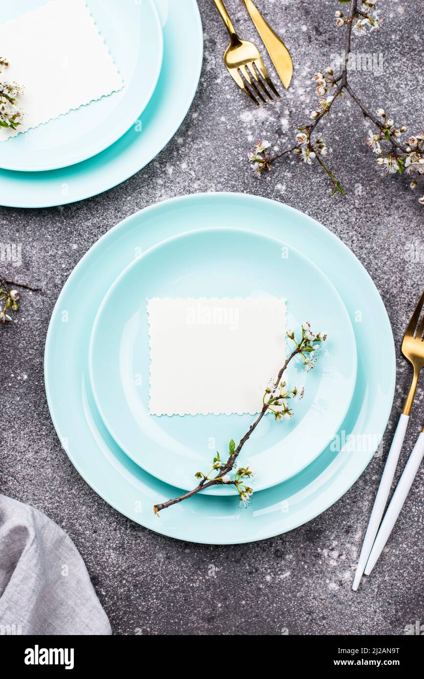 Spring table setting with blooming branch Stock Photo