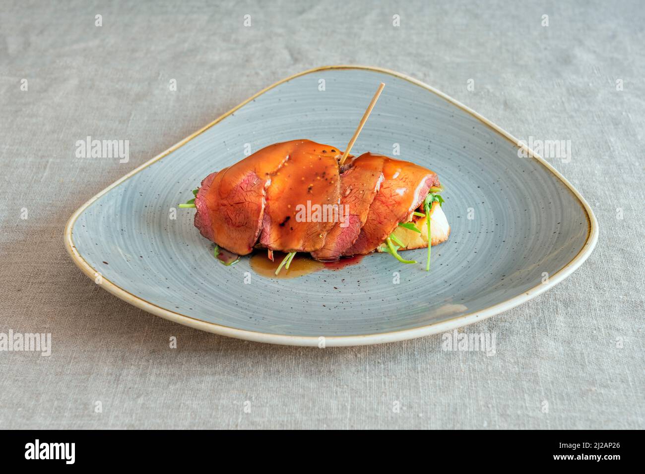 The Roast Beef is a cut of tender meat that is roasted in the oven. In