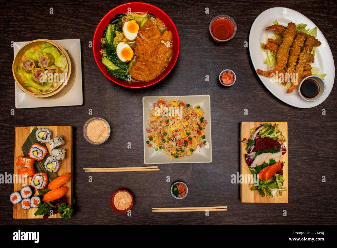 set of asian food dishes, with ramen, three delights rice, sia mai and  california roll, salmon nigiri, tuna maki, avocado and surimi uramaki, nori  sea Stock Photo - Alamy